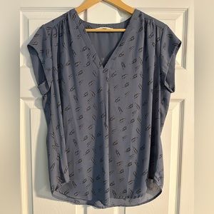 Blue top with black and white feather pattern